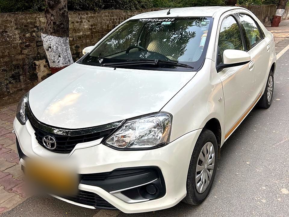 White Toyota Etios sedan for private chauffeur-driven tours